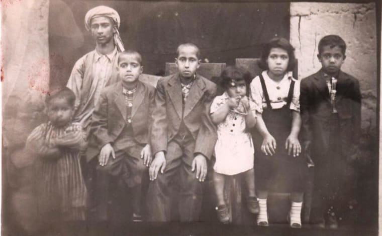 Atta Arghandiwal with his siblings before his departure, near the Oxus River.